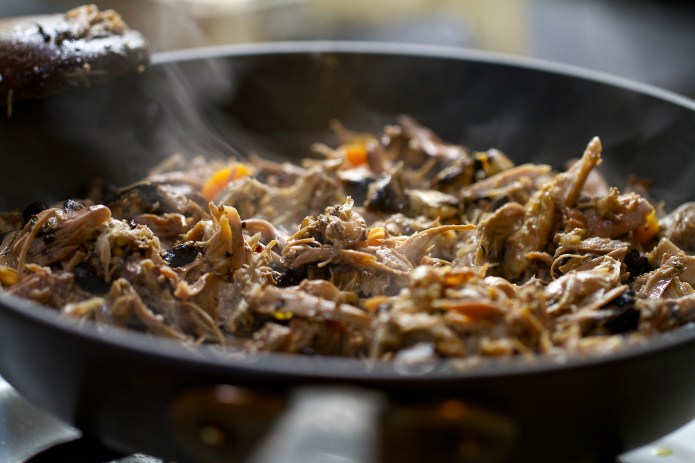 duck and mushroom in frying pan